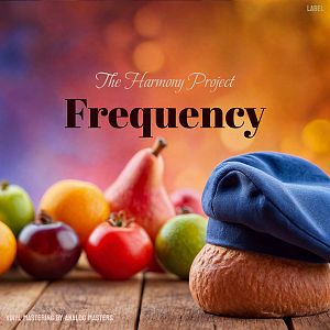 Pre Made Album Cover Brown Rust A loaf of bread with a blue hat in front of various fruits on a wooden surface with a colorful blurred background.
