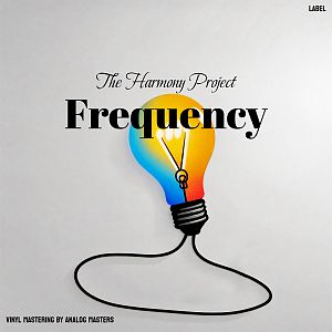 Pre Made Album Cover Quill Gray A brightly colored lightbulb with a black cord, glowing in a gradient of blue, yellow, and red on a plain white background.